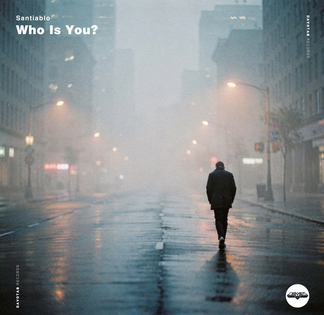 Santiablo lanza Who is You desde el Bronx | Pulsar Mix Radio FM Album cover: a lone man walks away through a foggy, rain-soaked city street at night; 'Santiablo Who Is You?' in the top-left.