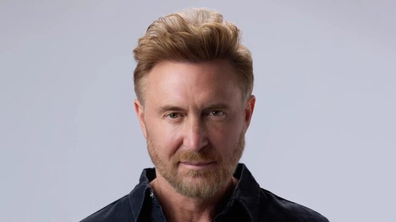 image-6-1 | Pulsar Mix Radio FM Close-up portrait of a man with light brown hair and a short beard, wearing a dark shirt, looking at the camera.